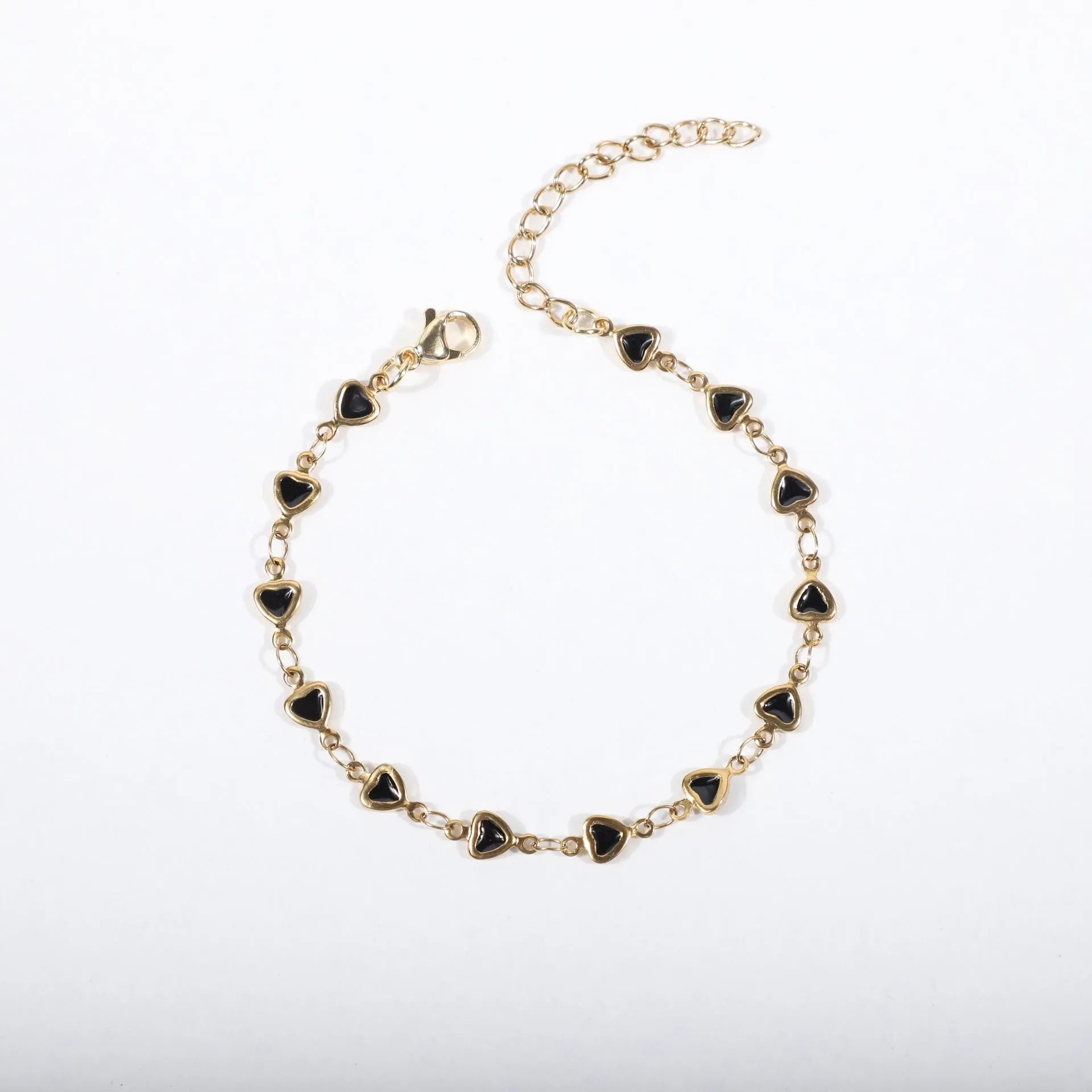 Stainless steel adjustable bracelet with a heart charm, shown in gold colour plating.