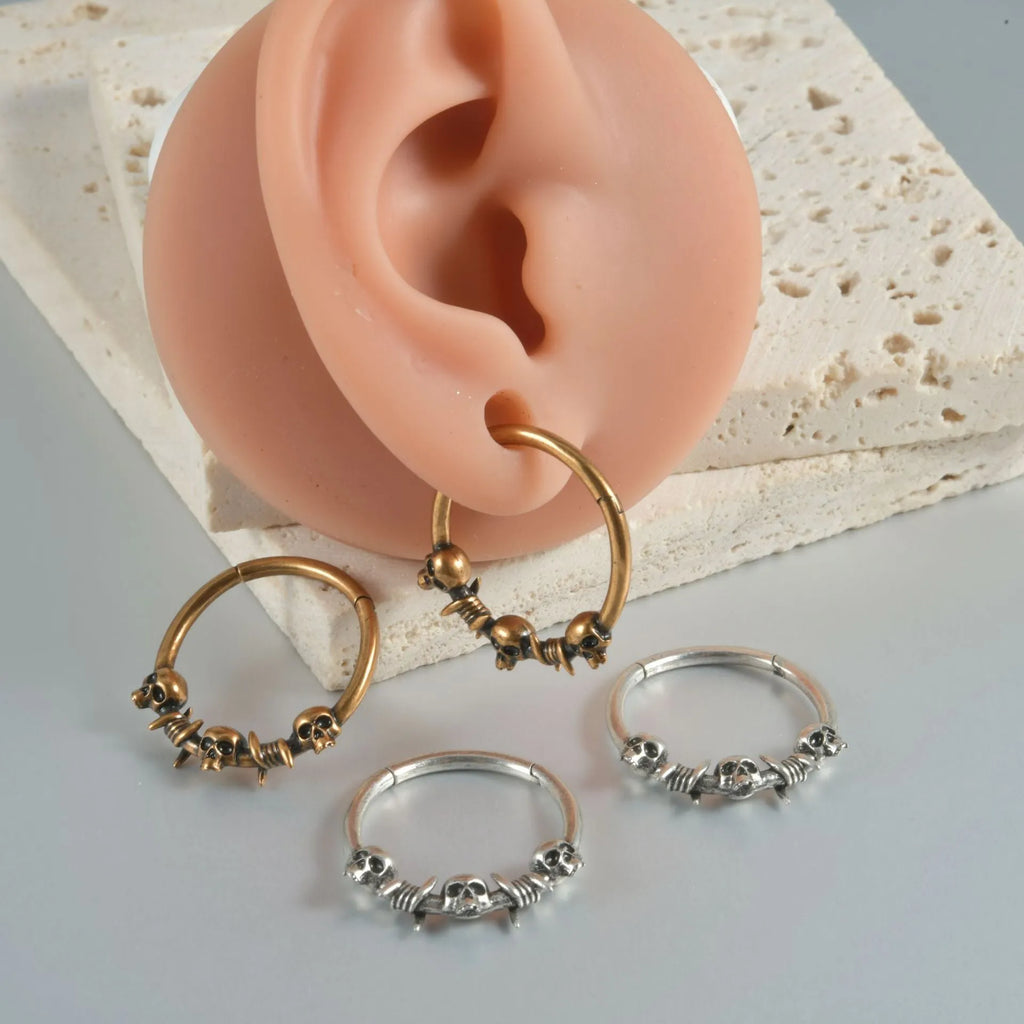 Copper punk earrings with antique silver finish and ghost head design