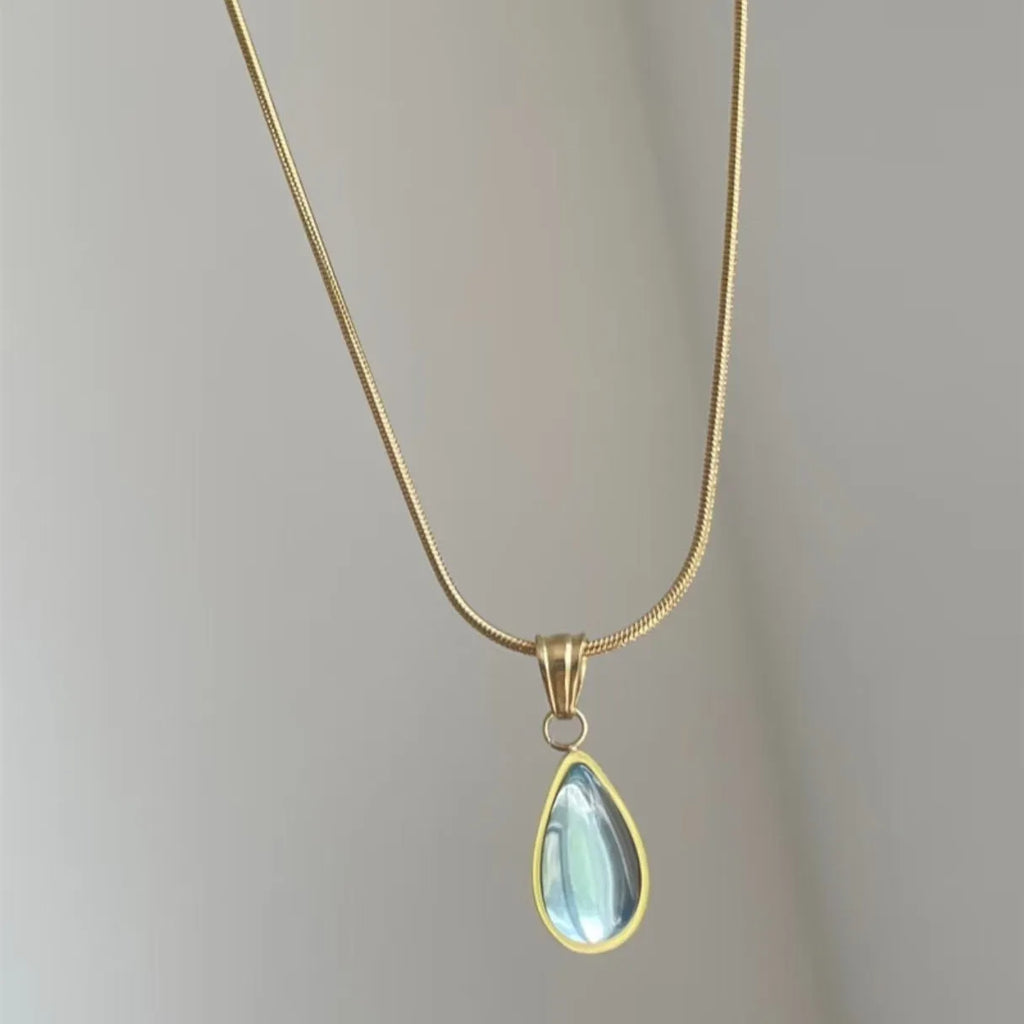 Water drop pendant necklace with gemstone inlay on snake bone chain in blue or green colour