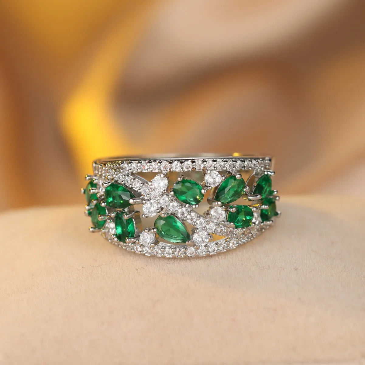 Women's hollow round fashion ring in gold or platinum with a choice of white or blue gemstone.