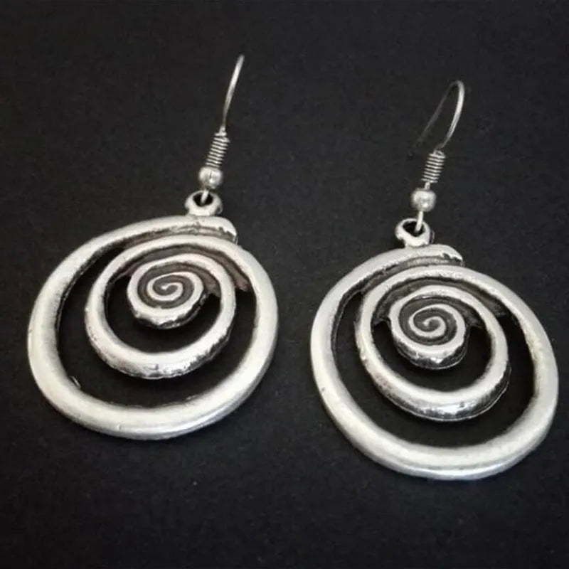 Silver geometric spiral distressed alloy dangle earrings showing retro design.