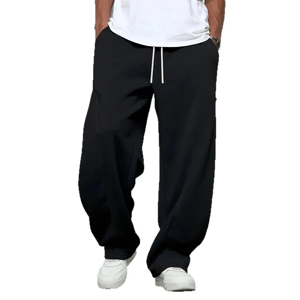 Men's straight-leg casual trousers with elastic waist in black, dark grey, and light grey colours