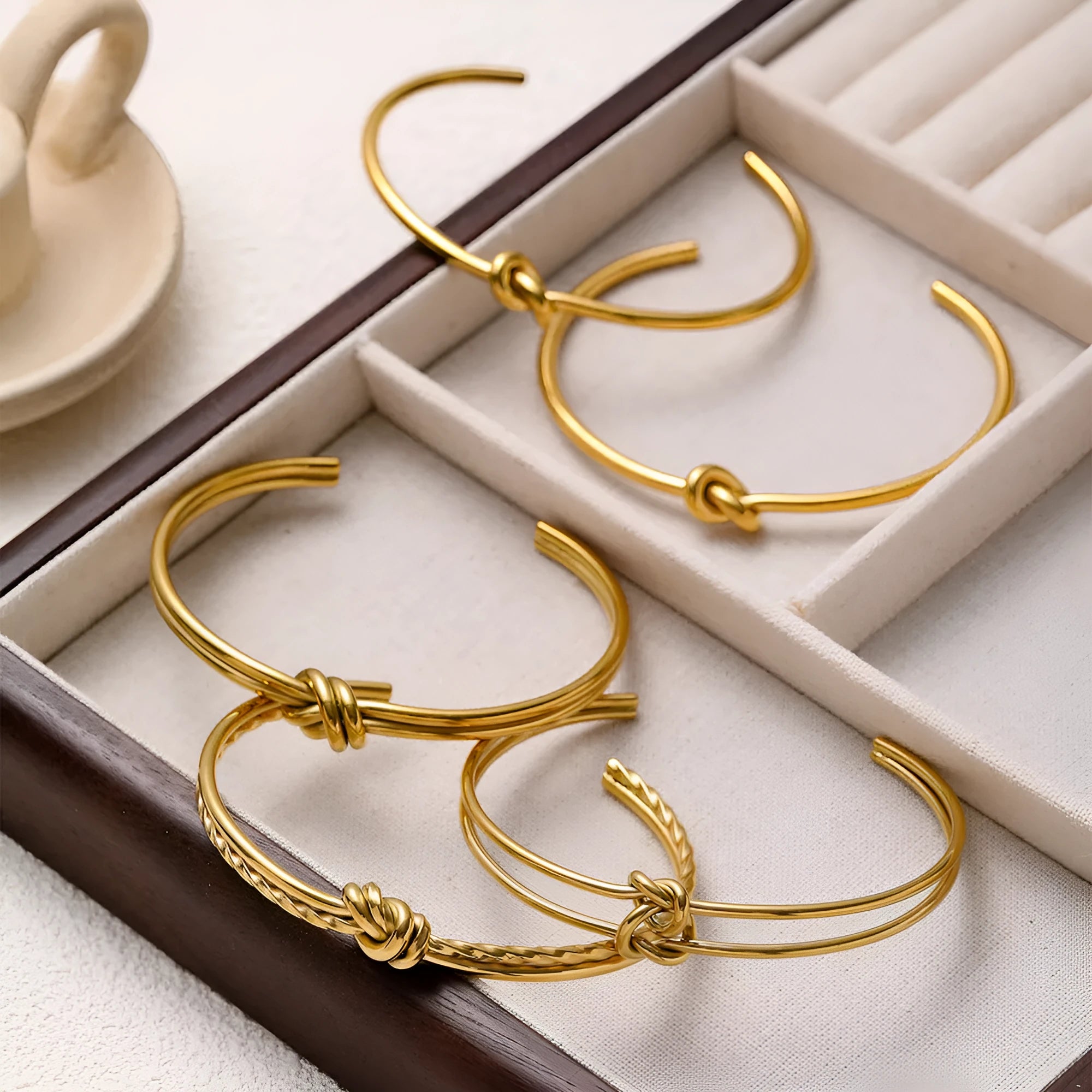 Women's stainless steel bracelet with C-shaped open design and knotted double-layer construction