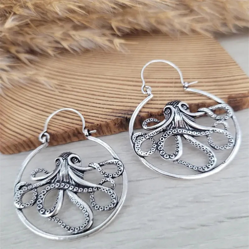 Vintage style octopus drop earrings in antique silver colour with detailed tentacle design