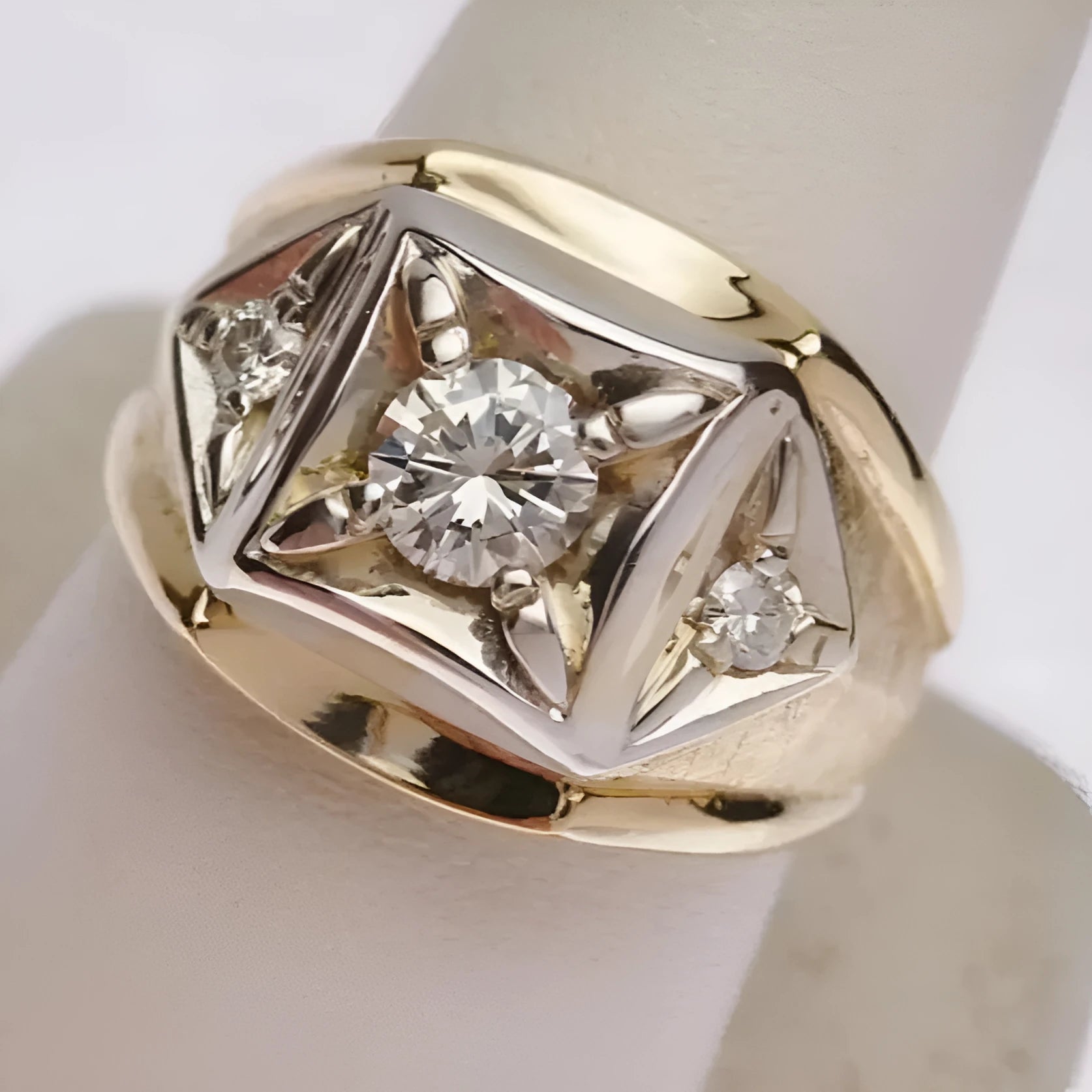 Geometric hollow gold-coloured copper couple rings with wide face design featuring chamfered square pattern
