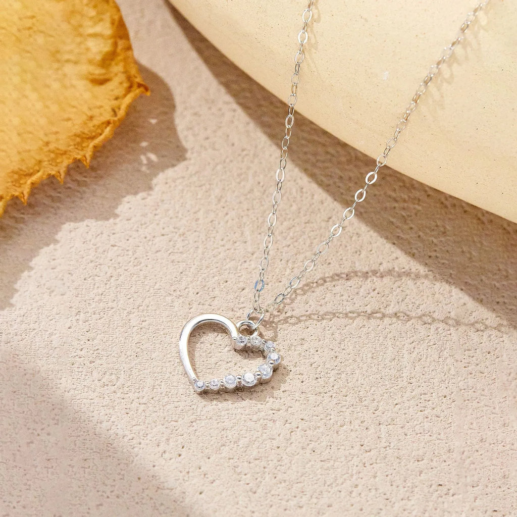 S925 sterling silver hollow heart necklace with circle detailing on regular chain