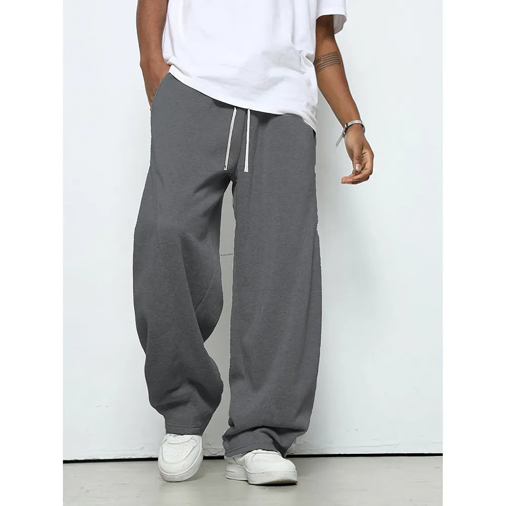 Men's straight-leg casual trousers with elastic waist in black, dark grey, and light grey colours