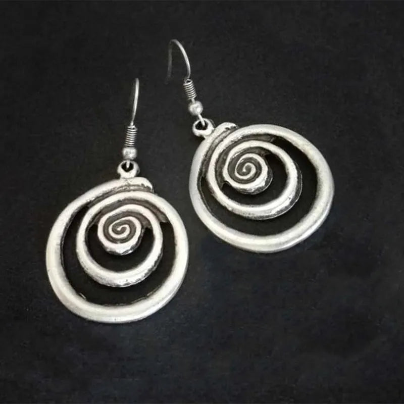 Silver geometric spiral distressed alloy dangle earrings showing retro design.