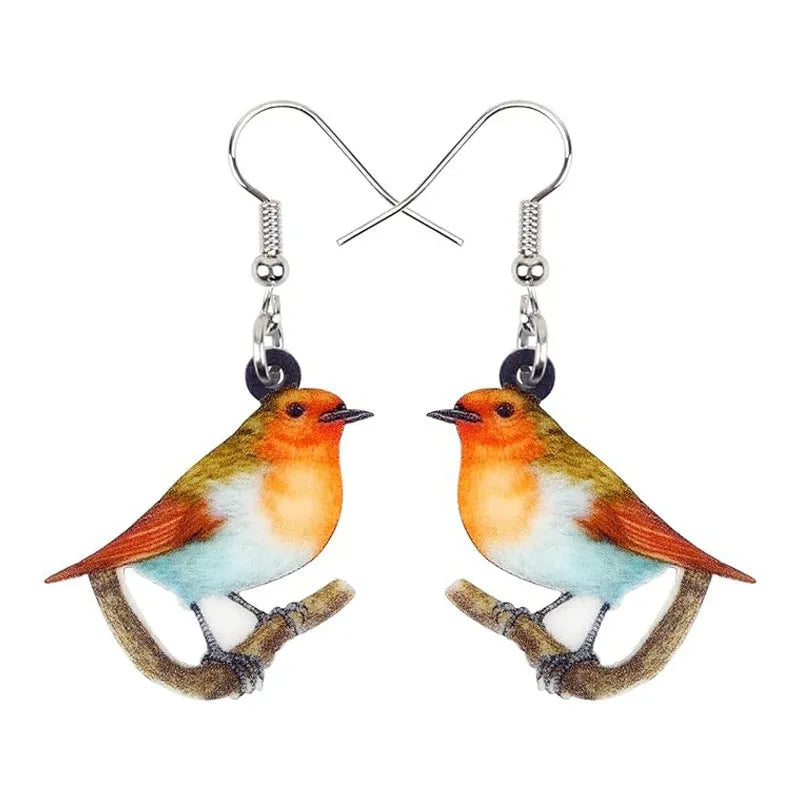 A pair of blue titmouse design pendant earrings made from printed acrylic on a geometric shape.