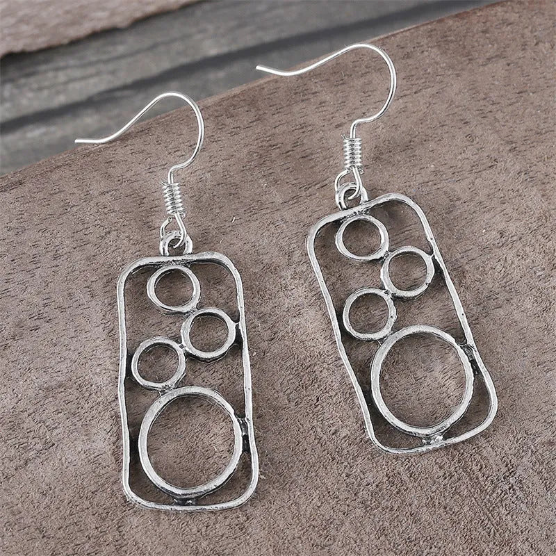 Geometric irregular square earrings within circular ring, antique silver finish on zinc alloy