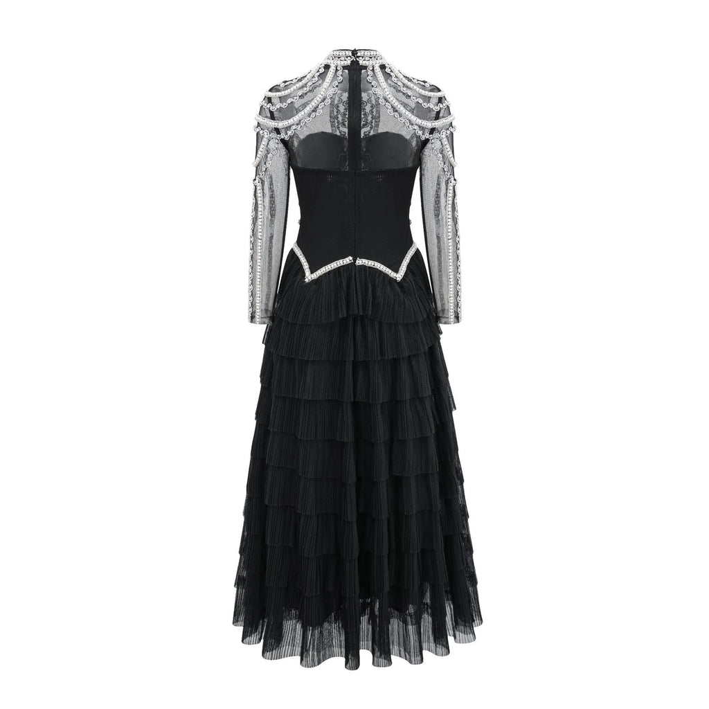 Women's black long sleeve dress with beaded embroidery and a mid waist design.