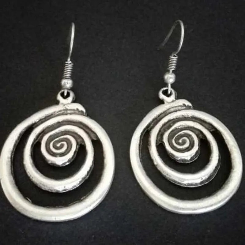 Silver geometric spiral distressed alloy dangle earrings showing retro design.