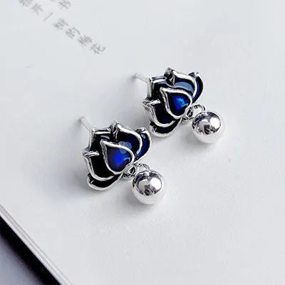 Blue Lotus alloy stud earrings with detailed lotus seedpod tassel and flower design