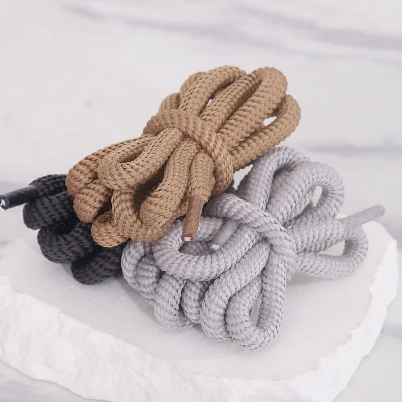 Oval elastic shoelace adapter ropes in various colours on a white background.