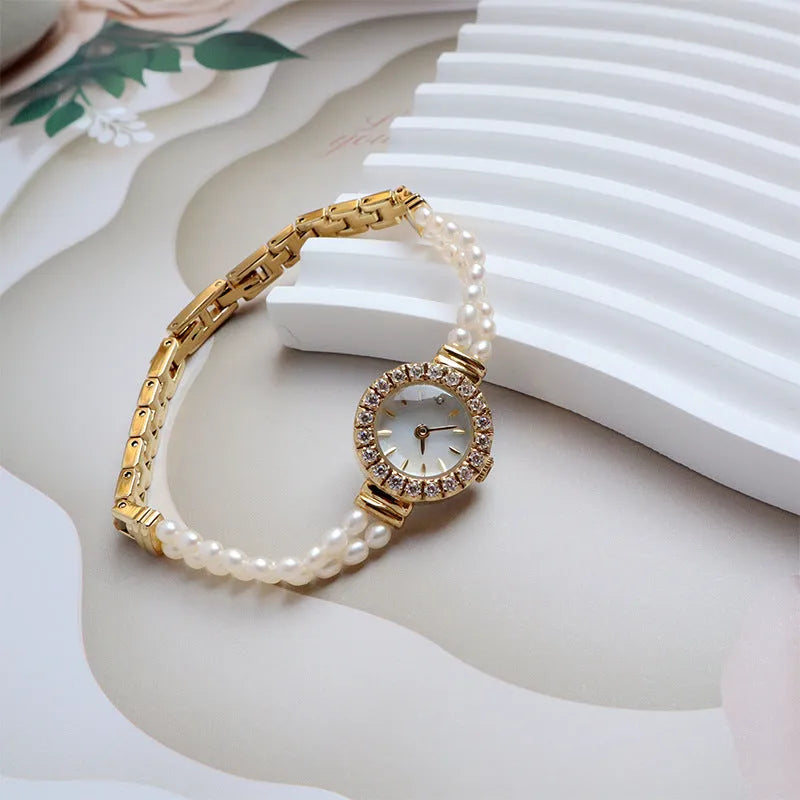 Light gold women's bracelet watch with freshwater pearls and 18mm round dial