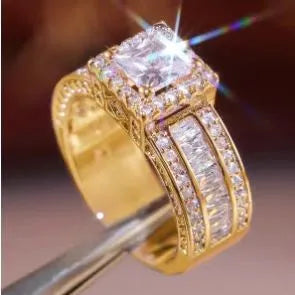 Geometric women's alloy ring with round details in gold or white electroplated finish.