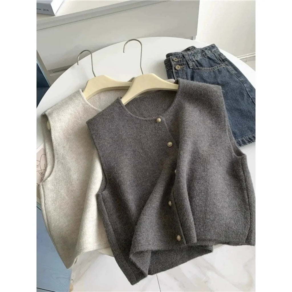 Women's polyester pullover vest with half sleeves in smoky grey, available in medium and large sizes by weight