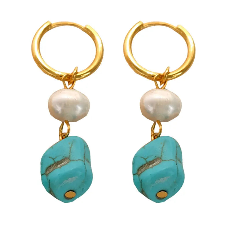 Geometric turquoise and cultured pearl earrings in short stud and long dangle styles on copper settings.