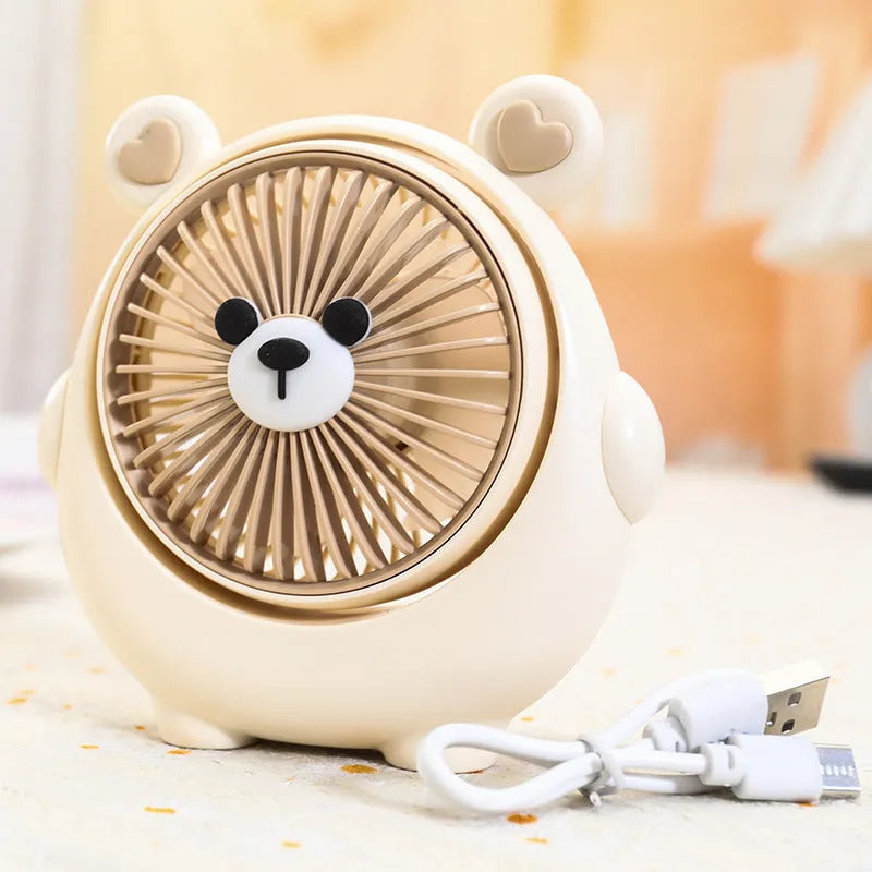 Cute dog-themed USB desktop electric fan on a desk, showing brown puppy colour variant.