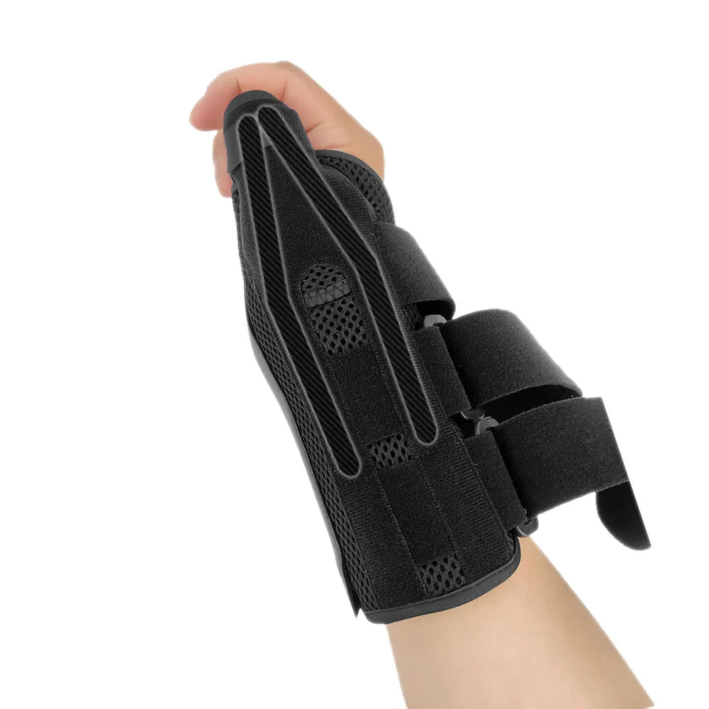 Black carbon fibre pattern wrist guard with grey edging and a thumb strap.