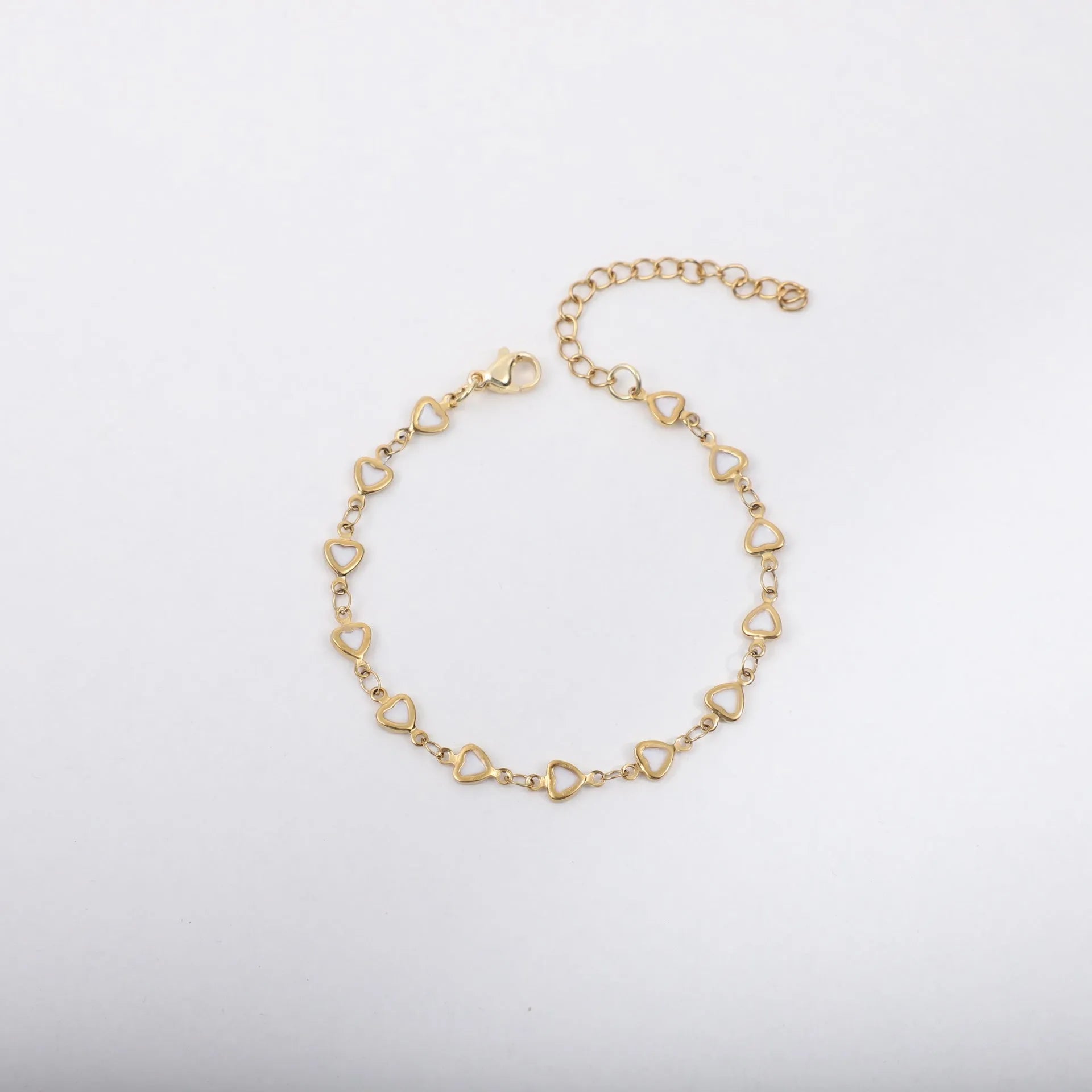 Stainless steel adjustable bracelet with a heart charm, shown in gold colour plating.