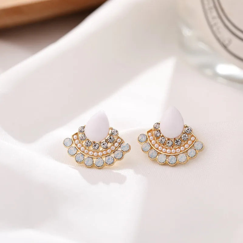 Women's retro fan-shaped alloy earrings with silver stud finish and opal rhinestone detail.