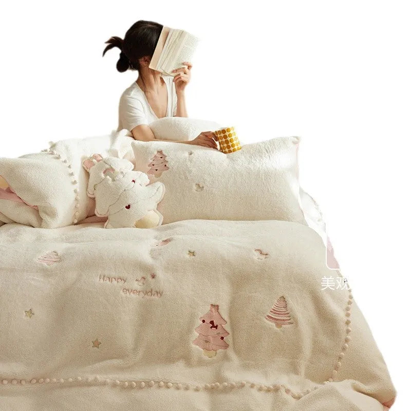 Princess-style four-piece bedding set with green Christmas tree pattern on a bed.