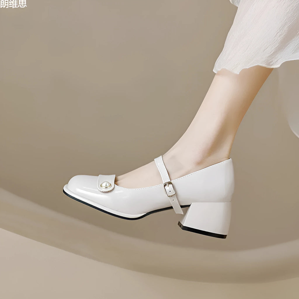 Women's apricot patent leather heel pumps with a chunky block heel and buckle fastening