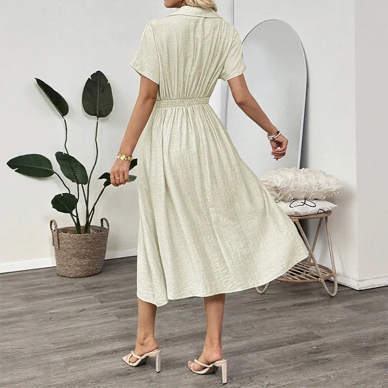 Light green women's shirt dress with lapel collar, waist-tight skirt, and pockets