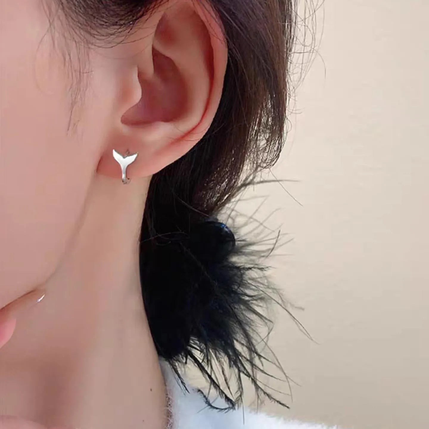 Women's fashion fishtail earrings in copper with electroplated white gold and yellow gold finishes