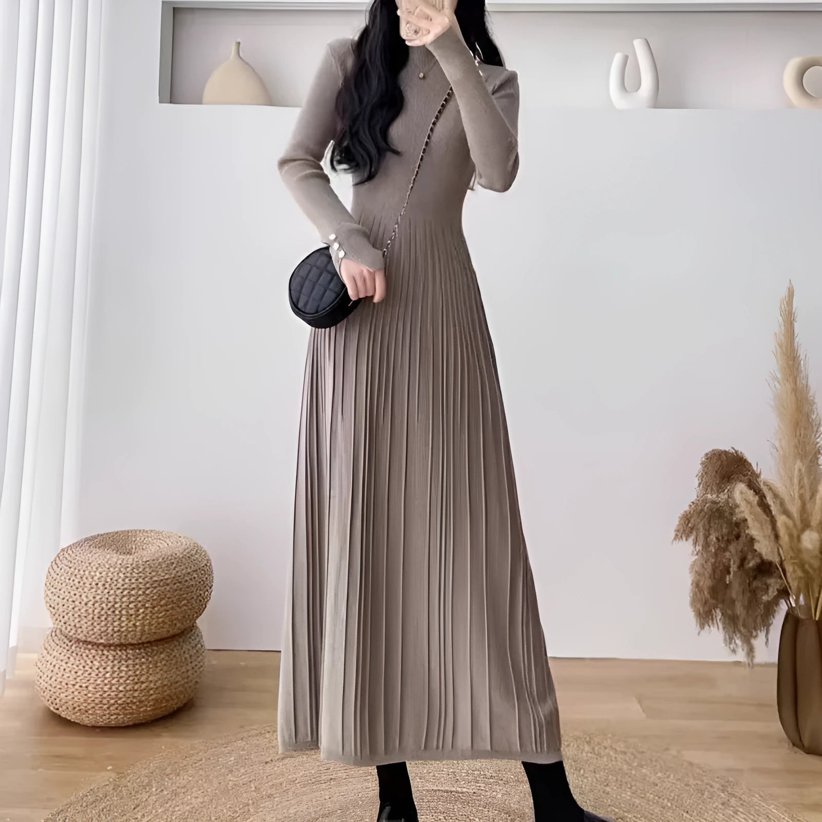 Women's high-waist knitted A-line skirt dress in a solid colour, mid-length below the knees.
