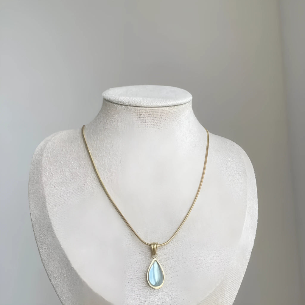 Water drop pendant necklace with gemstone inlay on snake bone chain in blue or green colour