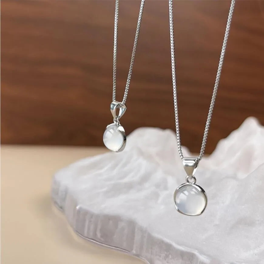 Korean-style oval pendant necklace with geometric crystal design on adjustable box chain