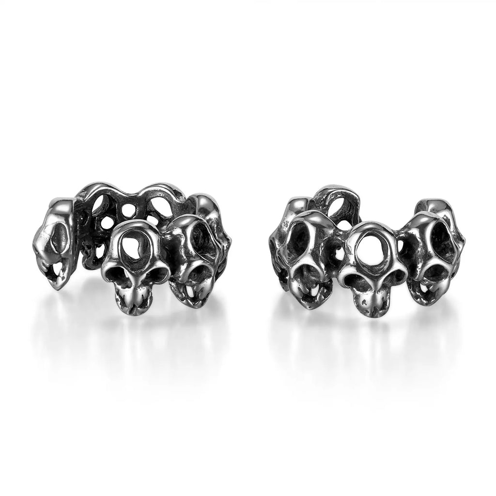 Stainless steel hollow skull ear clips with geometric design and metallic finish