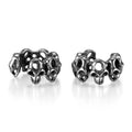 Stainless steel hollow skull ear clips with geometric design and metallic finish