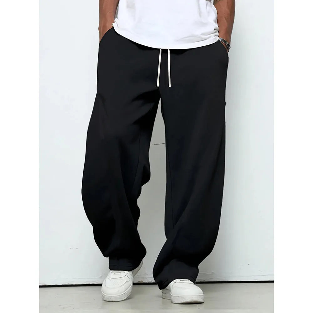 Men's straight-leg casual trousers with elastic waist in black, dark grey, and light grey colours
