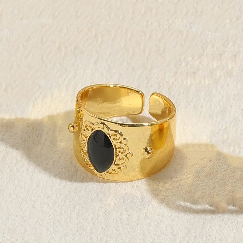 Geometric copper ring with Chinese style design and electroplated finish in horse eye black colour