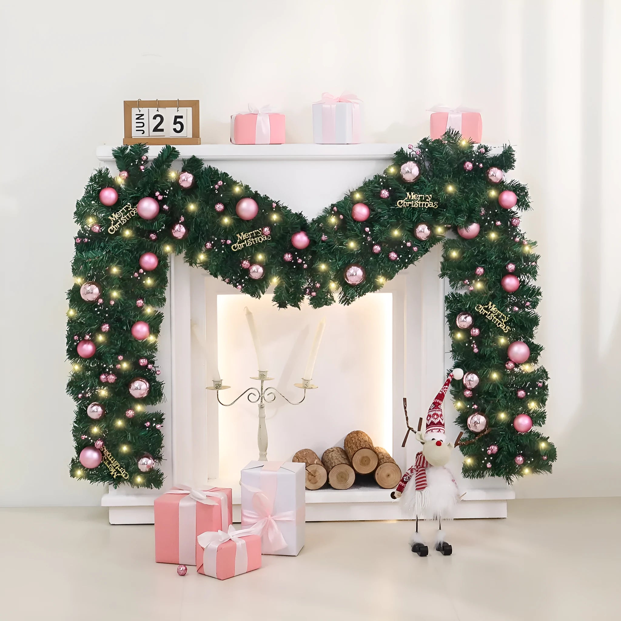 Pink Christmas rattan garland with small fruit details and LED lights draped across doorway