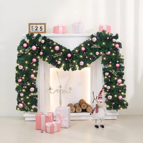 Pink Christmas rattan garland with small fruit details and LED lights draped across doorway