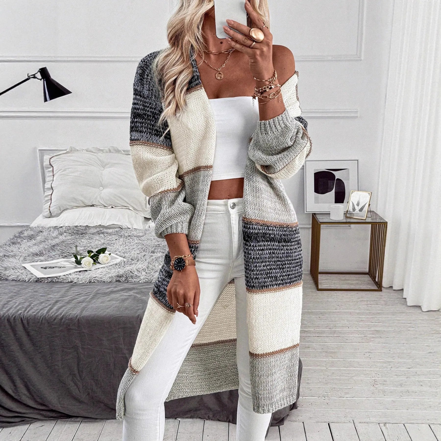 Grey striped knitted cardigan with loose fit and long sleeves