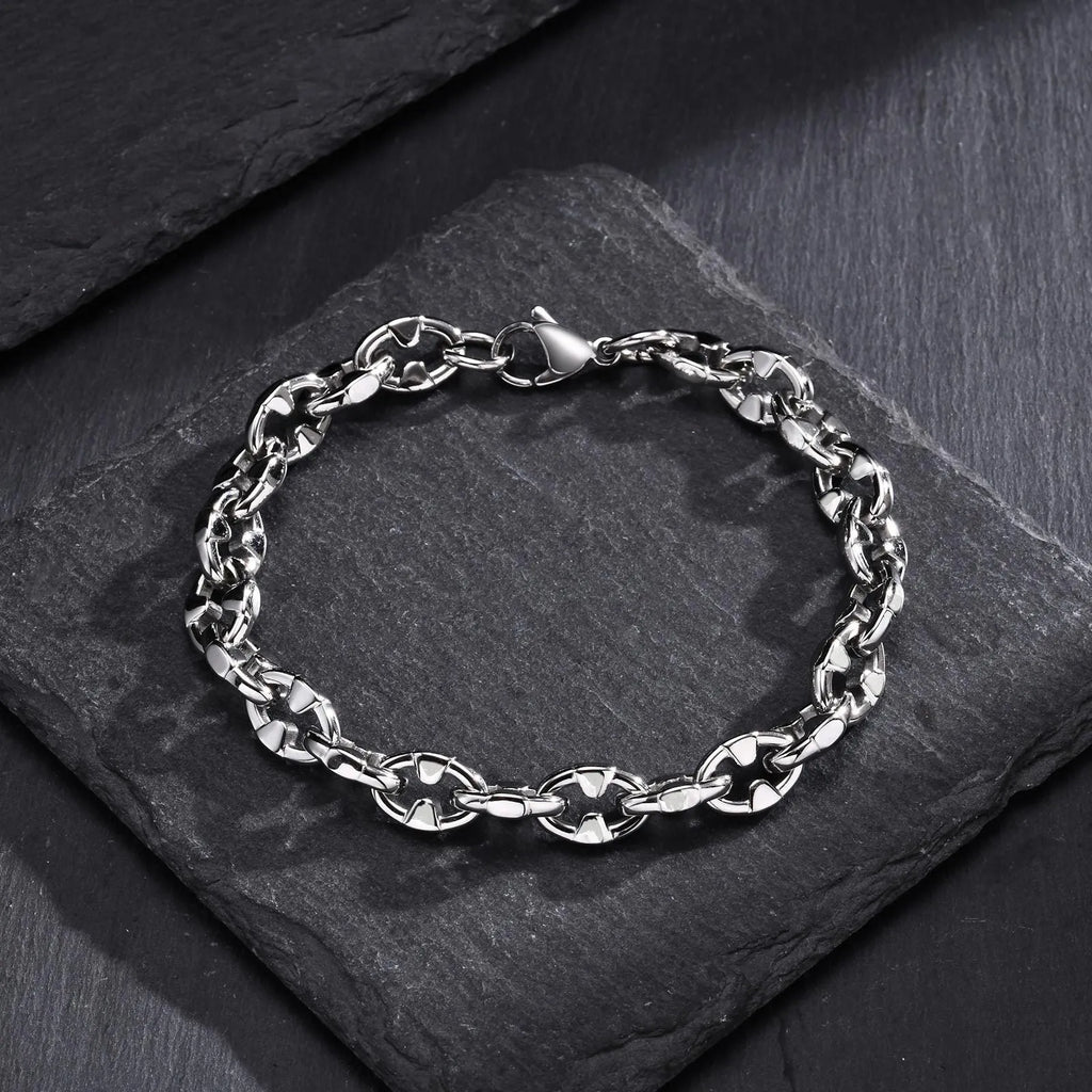A thick, geometric chain link bracelet made of stainless steel, shown in a steel colour.