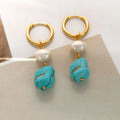 Geometric turquoise and cultured pearl earrings in short stud and long dangle styles on copper settings.