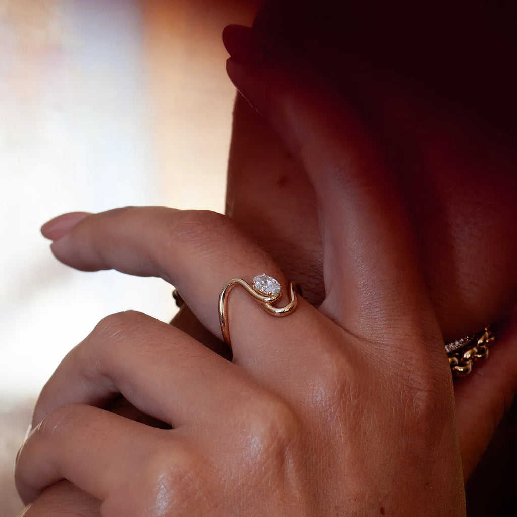 Silver tone geometric zircon ring with European-American styling on stainless steel background