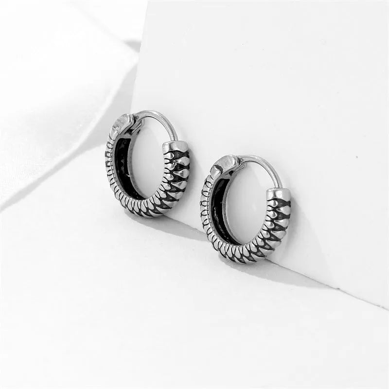 Silver geometric retro twist earrings with stripe detail, made from titanium steel.