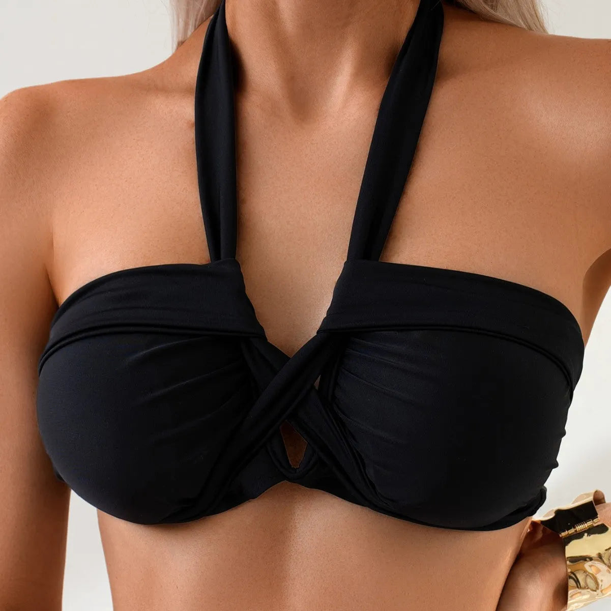 Black backless women's bikini swimsuit in briefs style for swimming.