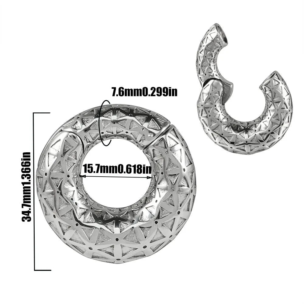 A pair of silver totem pattern stainless steel fashion earrings on a white background.