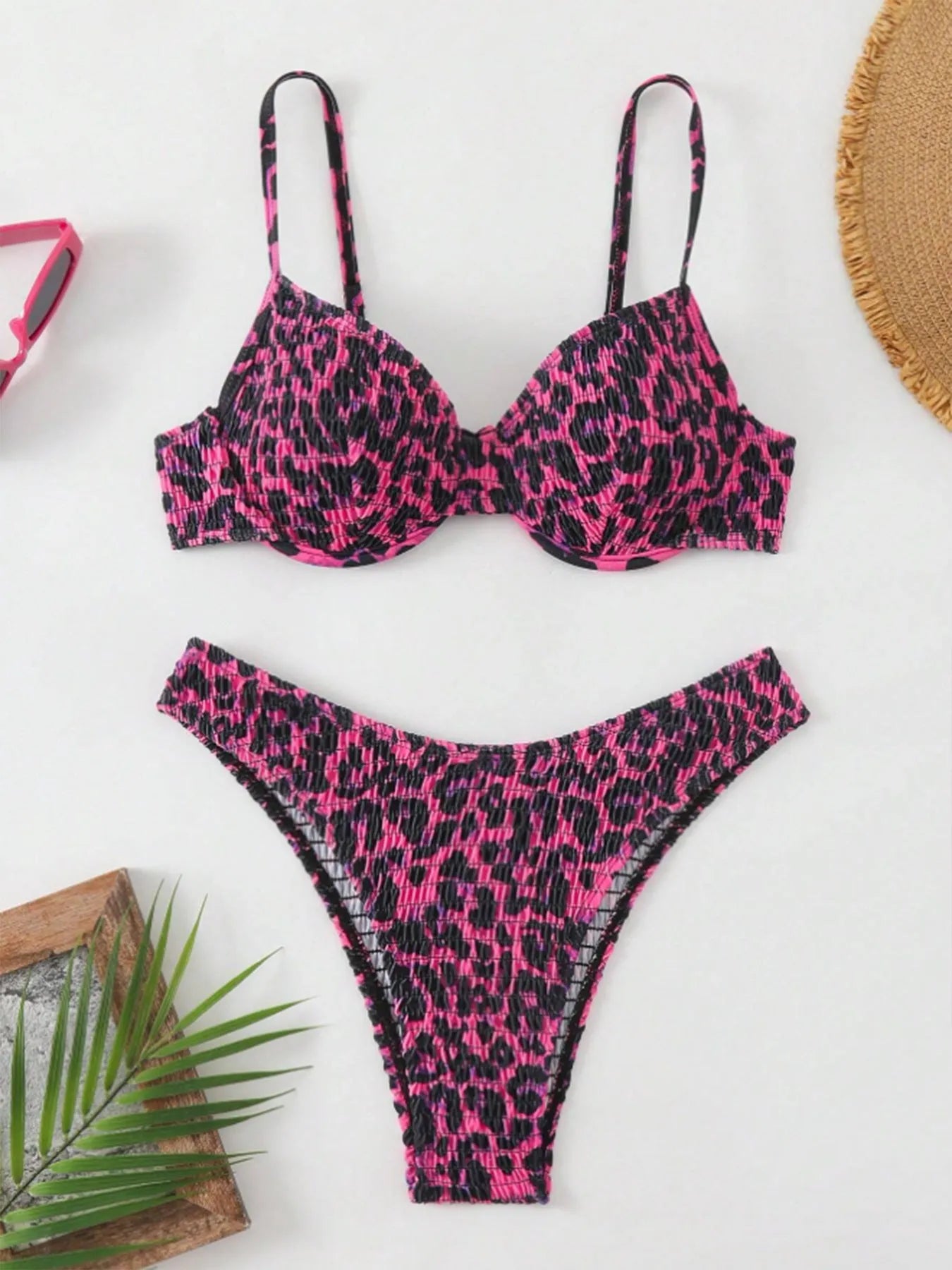 Brown leopard print backless bikini swimsuit for women laid flat.