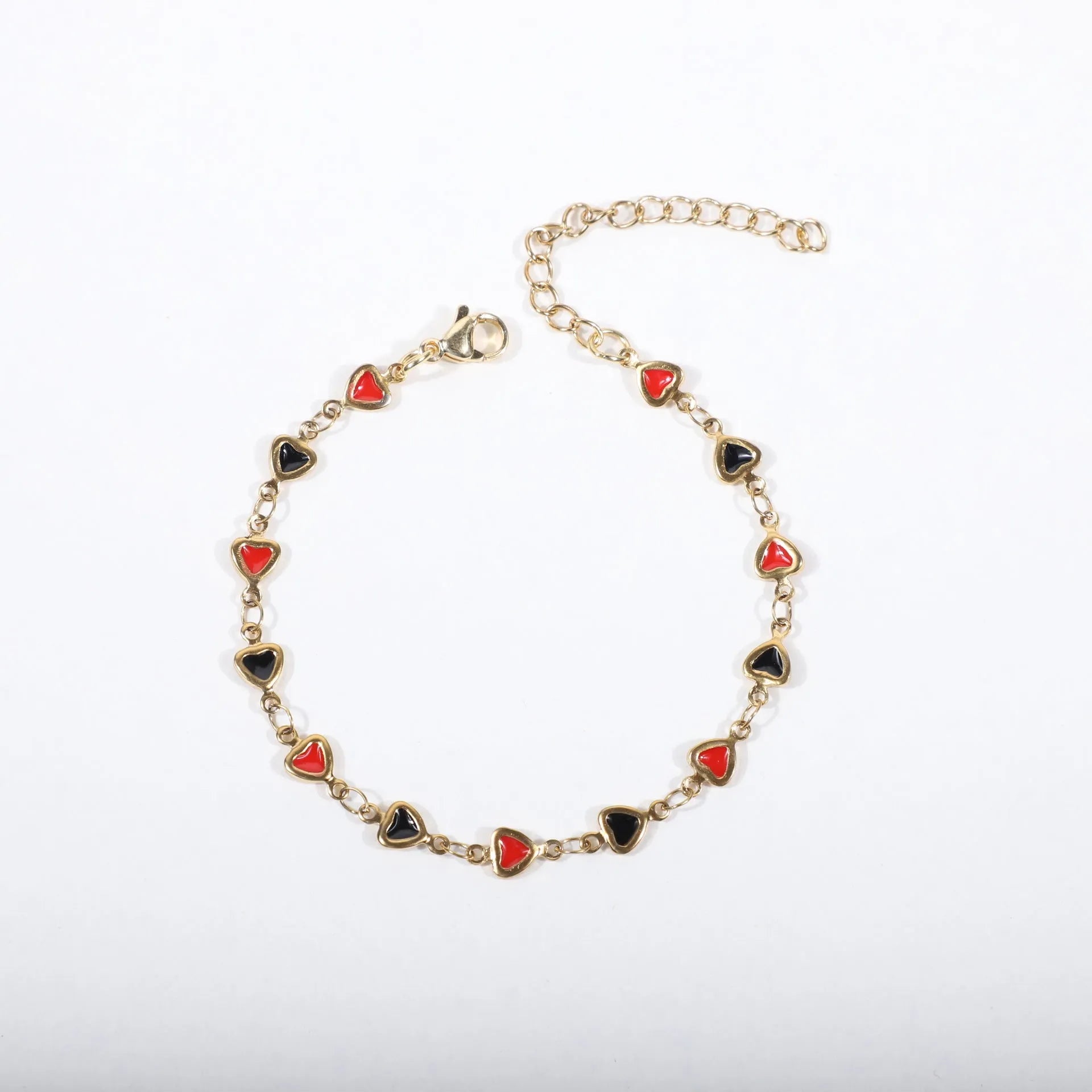 Stainless steel adjustable bracelet with a heart charm, shown in gold colour plating.