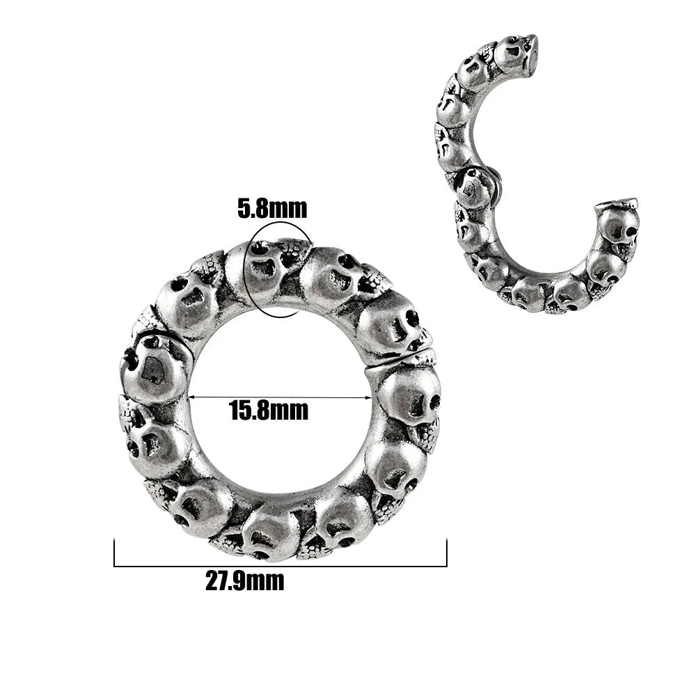 A pair of silver totem pattern stainless steel fashion earrings on a white background.