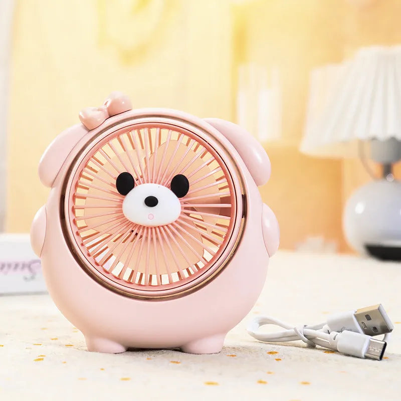 Cute dog-themed USB desktop electric fan on a desk, showing brown puppy colour variant.